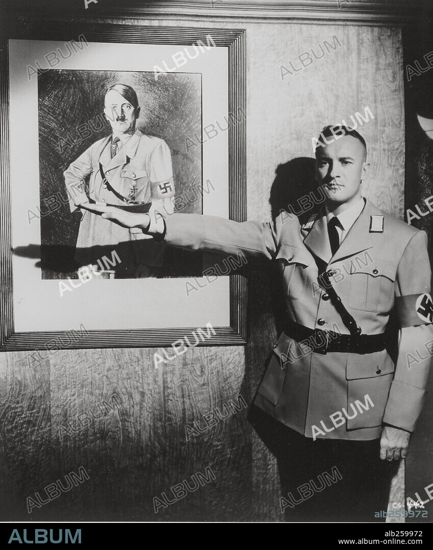 Adolf Hitler and GEORGE SANDERS. GEORGE SANDERS in CONFESSIONS OF A NAZI SPY, 1939, directed by ANATOLE LITVAK. Copyright WARNER BROTHERS.