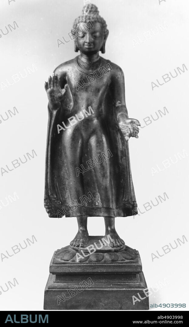 Standing Buddha, India, Gupta style of the 6th century, Culture: India, Bronze, Buddha without base: H. 13 1/4 (33.7 cm); W. 5 3/8 in. (13.7 cm); D. 3 in. (7.6 cm), Buddha with base: H. 16 1/4 in. (41.3 cm); W. 5 3/4 in. (14.6 cm); D. 4 3/4 in. (12.1 cm), Sculpture.