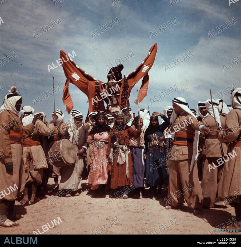 Romani Gypsy men and women, staging a Bedouin wedding, Syria 1938.